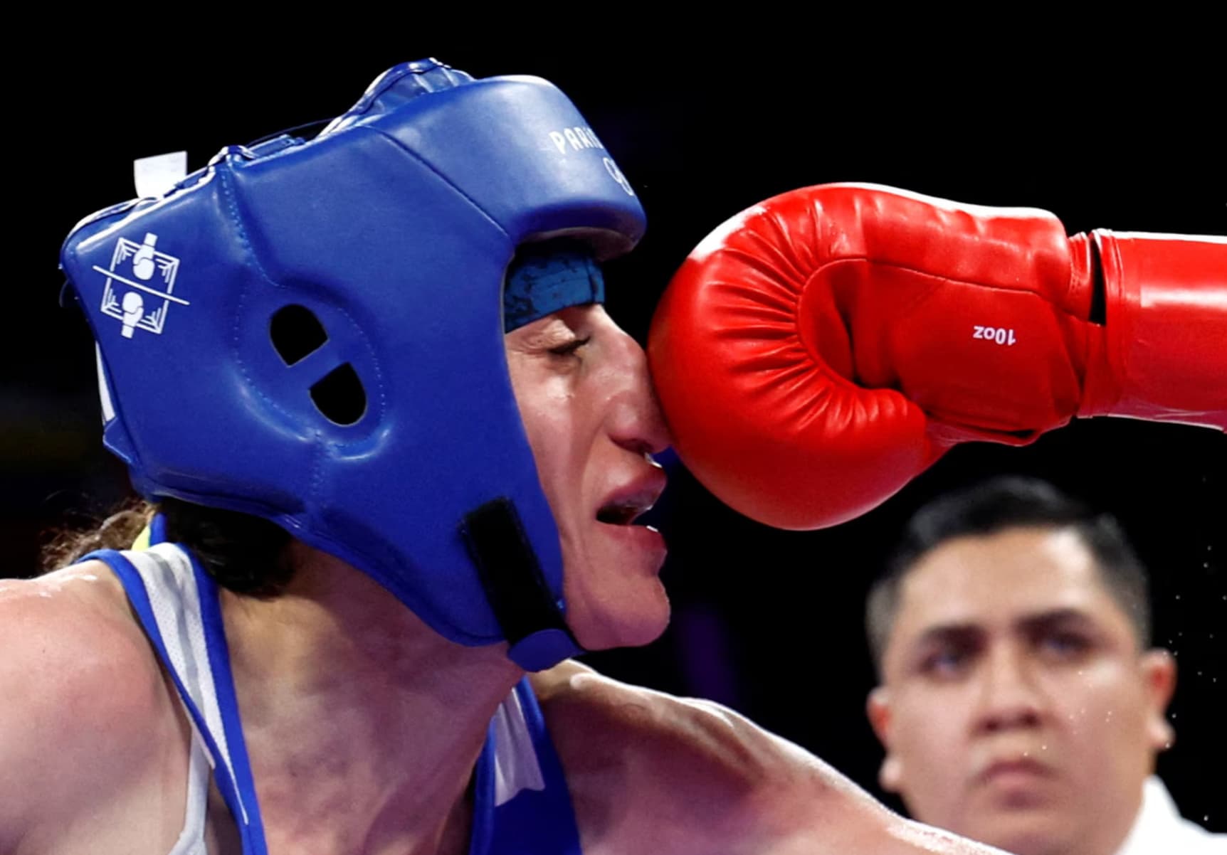 Italian boxer Alessia Mesiano lands a punch to the nose in a match against Turkey’s Gizem Ozer